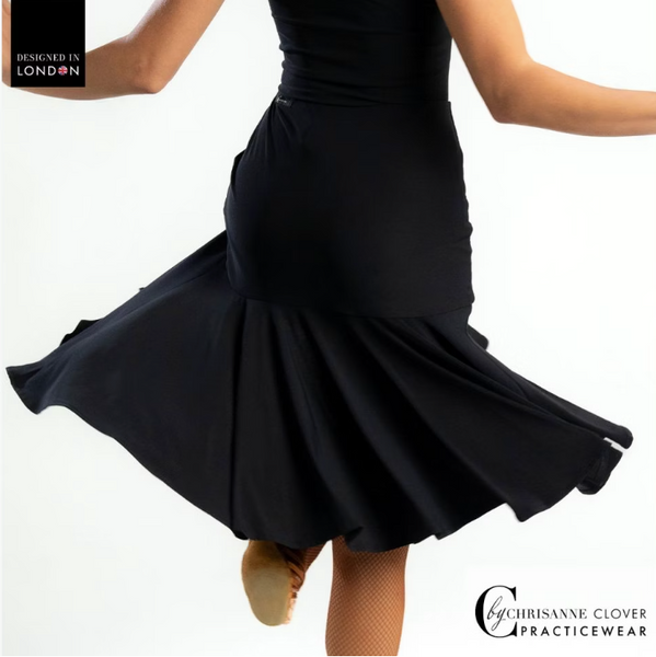 This knee-length Latin skirt showcases a flattering ruched front panel that elegantly scoops and gathers to the left, enhancing the silhouette of the wearer. The flared skirt, complete with a split on the left side, cascades gracefully from the ruched waistband, allowing for fluid movement and a captivating appearance.