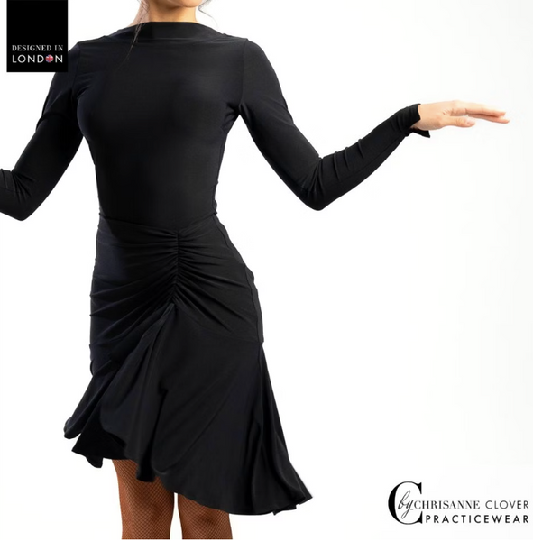 This knee-length Latin skirt showcases a flattering ruched front panel that elegantly scoops and gathers to the left, enhancing the silhouette of the wearer. The flared skirt, complete with a split on the left side, cascades gracefully from the ruched waistband, allowing for fluid movement and a captivating appearance.