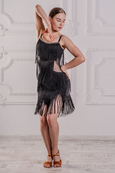 FREE AUSTRALIA-WIDE SHIPPING.  Best price worldwide.  Hot black latin fringe dress with body in silk jersey and sheer elastic mesh on the midriff. Elastic velvet straps and pretty decorative golden shimmer elastic neckline.  Flowy, scalloped lines of long fringing that swirl at every move and enhance your dancing. Cique golden clasp for back closure. Full body for your comfort. Perfect for Latin, Samba, Salsa performance, medals and dancesport competition.