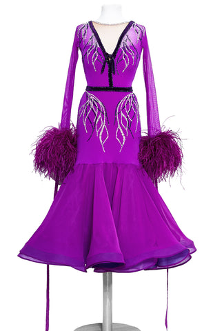 Hot magenta junior ballroom dress, with crystallized leaf pattern, in Swarovski AB and Purple crystals.  Lycra, stretch net and georgette fabrics paired with ostrich feather cuffs and georgette ribbons. The skirt is 3/4 length, perfect for tall and petite dancers as well.