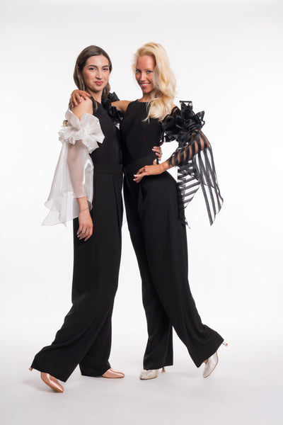 Free Australia-wide shipping. Great prices worldwide.

RS Atelier Zoe sleeveless dance bodysuit

Make a statement on the dance floor in the RS Atelier Zoe. This sleeveless bodysuit is finished with elegant ruffled arm floats for a distinctive ballroom look, suitable for lessons, practice, performance and special occasions.

Currently available in black or white. The striped version shown in the product photo is not currently available. Contact us by email to be notified if it becomes available.

Details
Sle