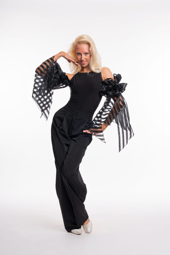 Free Australia-wide shipping. Great prices worldwide.

RS Atelier Zoe sleeveless dance bodysuit

Make a statement on the dance floor in the RS Atelier Zoe. This sleeveless bodysuit is finished with elegant ruffled arm floats for a distinctive ballroom look, suitable for lessons, practice, performance and special occasions.

Currently available in black or white. The striped version shown in the product photo is not currently available. Contact us by email to be notified if it becomes available.

Details
Sle