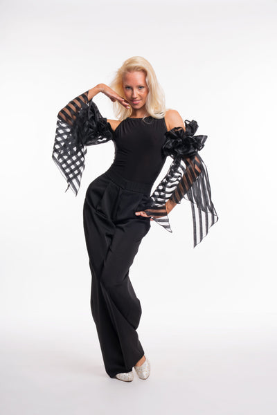 Free Australia-wide shipping. Great prices worldwide.

RS Atelier Zoe sleeveless dance bodysuit

Make a statement on the dance floor in the RS Atelier Zoe. This sleeveless bodysuit is finished with elegant ruffled arm floats for a distinctive ballroom look, suitable for lessons, practice, performance and special occasions.

Currently available in black or white. The striped version shown in the product photo is not currently available. Contact us by email to be notified if it becomes available.

Details
Sle