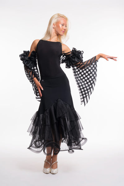 Free Australia-wide shipping. Best price worldwide.

RS Atelier Pepper black organza ballroom skirt

Add elegant movement to your dance wardrobe with the RS Atelier Pepper. This black Italian ballroom skirt features layered organza ruffles and pairs beautifully with a leotard or dance top for practice and performance.

Details
Women's black ballroom skirt with layered organza ruffles