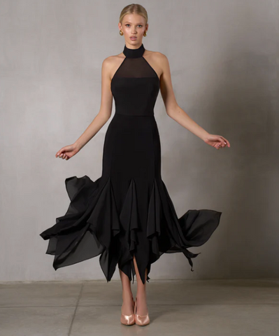 Free Australia-wide Shipping.&nbsp; Best price worldwide.


The Alaya Skirt is crafted to make you the center piece of everyone's attention. Its asymmetrical hem, adorned with raw chiffon pieces, creates a dynamic and fluid effect, amplifying the grace and emotion of your dance. A perfect choice for ballroom dancing where every detail matters.