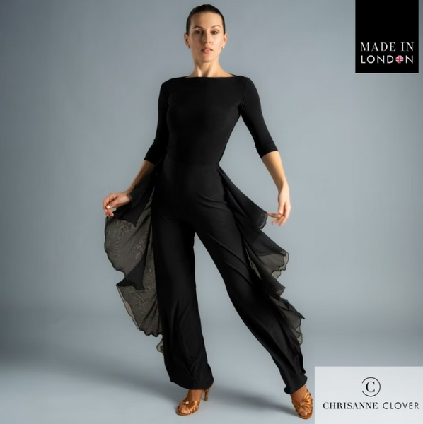 The Payton Trousers are designed for dancers who want style and movement combined. Featuring two layers of georgette frills placed along the side seams, these trousers create dazzling motion with every step. The frills are finished with a delicate roll hem for a refined touch, while the trousers themselves are crafted from premium stretch crepe and finished with an overlock hem for durability.

A crystallized Chrisanne Clover logo sits on the back left hip, adding a luxurious detail. Perfect for both ballro