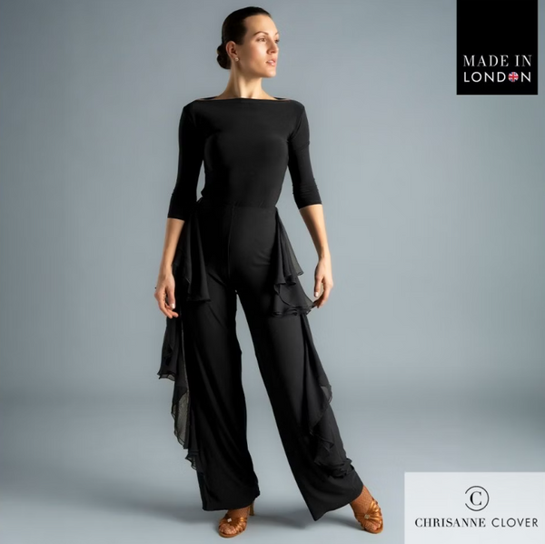 The Payton Trousers are designed for dancers who want style and movement combined. Featuring two layers of georgette frills placed along the side seams, these trousers create dazzling motion with every step. The frills are finished with a delicate roll hem for a refined touch, while the trousers themselves are crafted from premium stretch crepe and finished with an overlock hem for durability.

A crystallized Chrisanne Clover logo sits on the back left hip, adding a luxurious detail. Perfect for both ballro