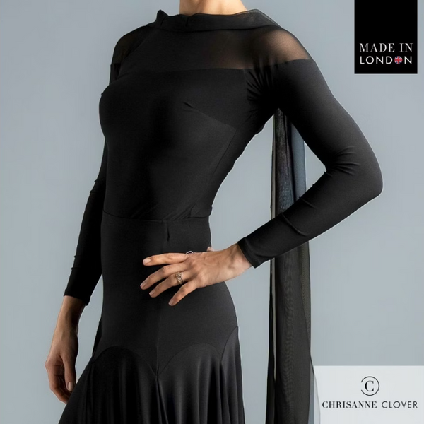 The Darcy Top is the epitome of elegance and movement, designed to make an impression both on and off the dance floor. Featuring a flowing georgette scarf detail that cascades gracefully down the back, this top adds dramatic flair to every turn.

The design combines a stretch net top piece that drops below the shoulder with a contrasting stretch crepe bodice and sleeves for a sophisticated layered look. A large diamond-shaped keyhole back fastens with a single covered button and is embellished with a brande