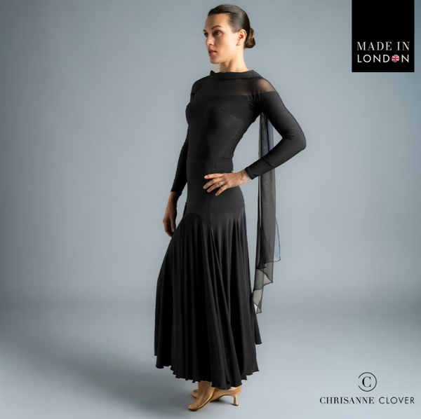 The Darcy Top is the epitome of elegance and movement, designed to make an impression both on and off the dance floor. Featuring a flowing georgette scarf detail that cascades gracefully down the back, this top adds dramatic flair to every turn.

The design combines a stretch net top piece that drops below the shoulder with a contrasting stretch crepe bodice and sleeves for a sophisticated layered look. A large diamond-shaped keyhole back fastens with a single covered button and is embellished with a brande