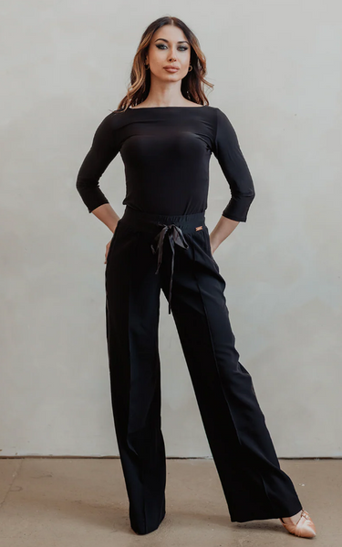 FREE Australia-wide Shipping | Best Price Worldwide

Meet the Brooklyn Pants by Miari — effortlessly polished, beautifully fluid, and designed to move with you. Featuring a flattering mid-to-high rise waist and a relaxed straight-leg silhouette, the Brooklyn Pants create clean lines that elongate the body without restricting motion. The fabric drapes fluidly, making them ideal for dance practice, travel, and polished off-duty wear.