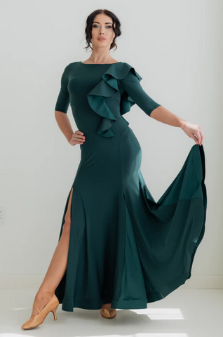 the Federica Ruffle Gown in Emerald Smoke is designed for dancers who know that presence is everything. Whether you're stepping onto the competition floor for your first DanceSport competition, performing at a showcase, or attending a formal evening event, this gown delivers effortless sophistication and graceful movement in equal measure.

A sweeping, wide skirt with delicate mesh inserts flows beautifully as you move, while the horsehair trim and cascading ruffle detail add layers of glamour that catch th
