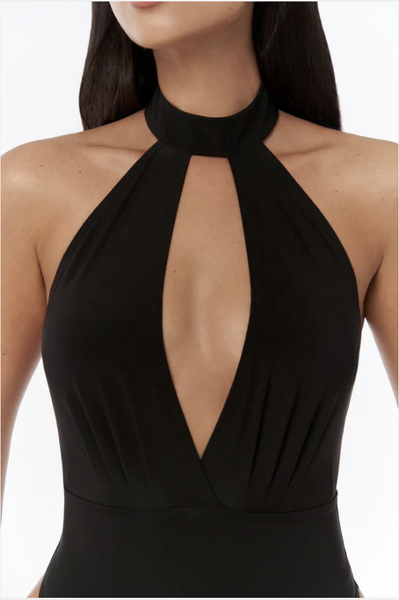 Black halter neck dress with a deep neckline on a white background