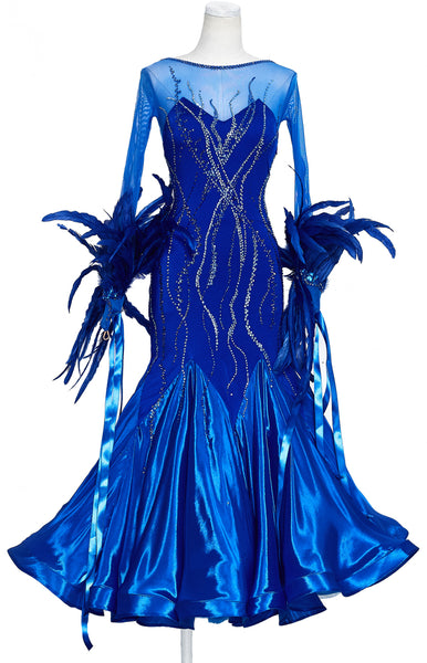 Ballroom dress in intense royal blue colour, siren like silhouette, with full pearl chiffon skirt, long stretch net sleeves with luxury rooster feather detailing and satin ribbons for the arms.  The dress is fully decorated with blue, turquoise and white Swarovski crystals, in different shades and sizes.
