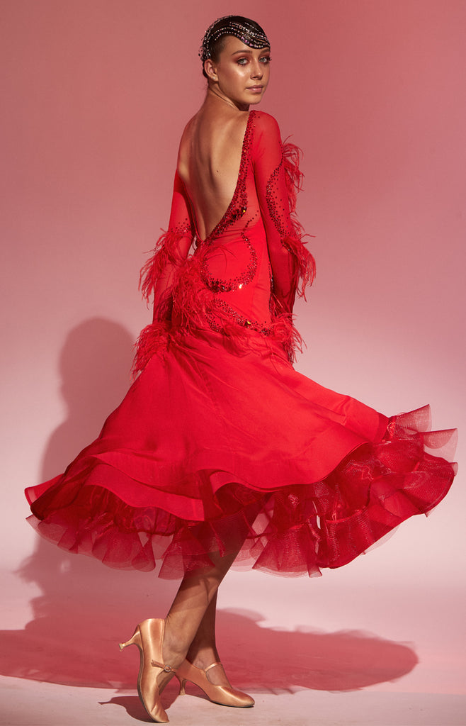 Free Australia-wide express shipping.  Best price guarantee worldwide - worldwide shipping included.  Scarlet bright red ballroom dress, with Light Siam Swarovski crystal decorations, ostrich feather trimming, long mesh sleeves, and a full 3/4 length skirt.  Eye catching on the dance floor, perfect silhouette for tall slim girls.