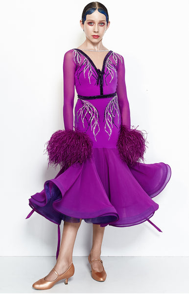 Hot magenta junior ballroom dress, with crystallized leaf pattern, in Swarovski AB and Purple crystals.  Lycra, stretch net and georgette fabrics paired with ostrich feather cuffs and georgette ribbons. The skirt is 3/4 length, perfect for tall and petite dancers as well.