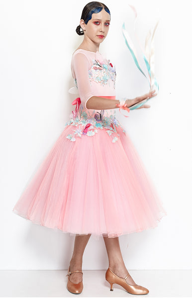 Junior ballroom dress, in sugar pink, with tulle stiff net pleated skirt, decorated with pastel coloured flowers, petals, and butterflies.  Pink satin ribbons around the wrists and waist.   This stunning, fully completed, ready to wear Junior Ballroom DanceSport Competition Dress can be created in any colour and size.